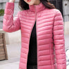 Doudoune fine mi-longue rose à col haut pour femme