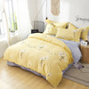 Parure de lit jaune motif fleurs blanches