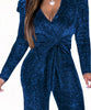 Combinaison bleu marine à paillettes élégante pour soirées chics, disponible chez [Nom de la Boutique].