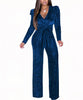 Combinaison bleu marine à paillettes élégante avec manches longues et ceinture, disponible chez Fashion Boutique.