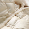 Doudoune beige fourrée à col haut pour femme