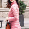 Doudoune fine mi-longue rose à col haut pour femme