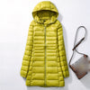Doudoune mi-longue jaune à capuche pour femme