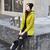 Doudoune mi-longue jaune à capuche pour femme