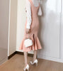 Ensemble jupe-salopette rose et chemisier