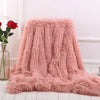Plaid en fausse fourrure vieux rose